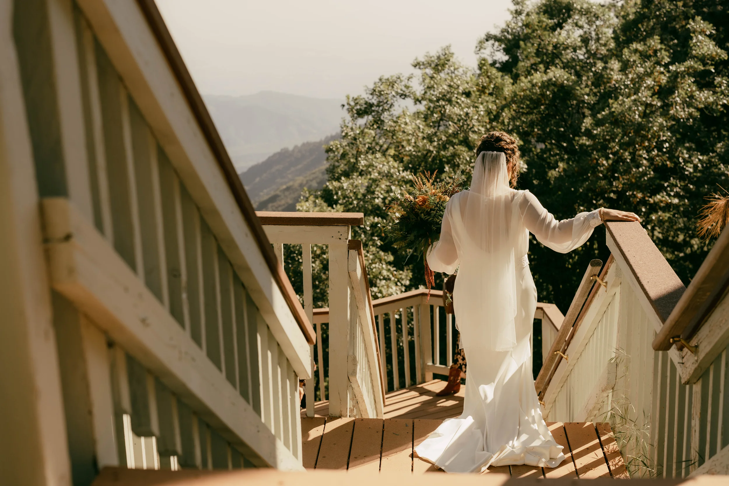 the sky view inn mountain wedding lower deck bride walking down stairs